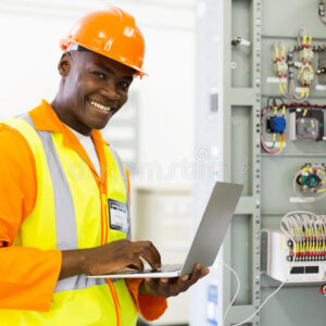 african-electrical-engineer-using-laptop-successful-checking-machine-status-66508744